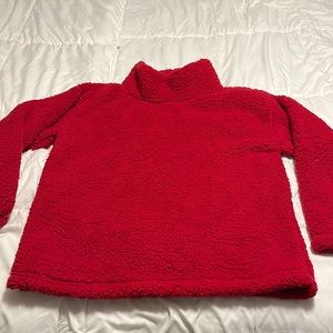 Brand new tried on once size large red ladies fluffy pullover